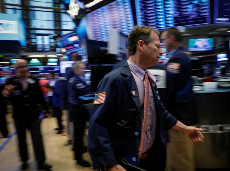 Traders work on the floor of the NYSE in New York