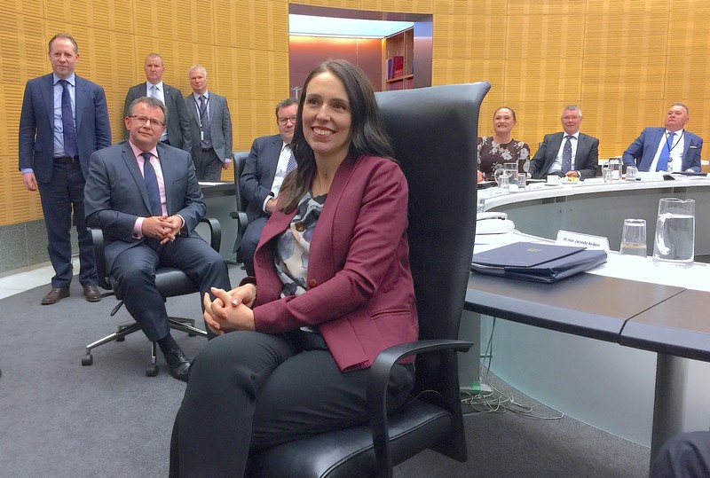 New Zealand Prime Minister Jacinda Ardern sits in a chair as she attends her first cabinet meeting since returning from maternity leave in Wellington