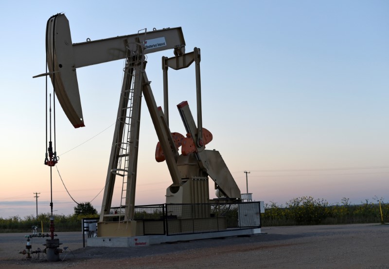 FILE PHOTO: A pump jack operates at a well site leased by Devon Energy Production Company near Guthrie, Oklahoma