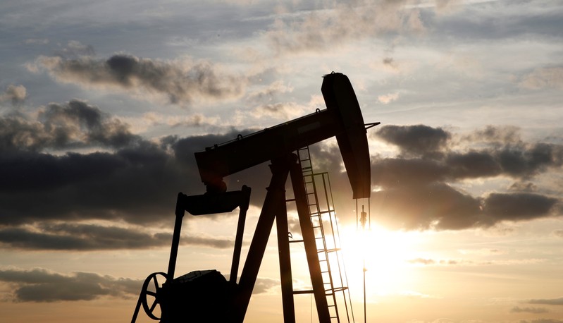 FILE PHOTO: An oil pump is seen at sunset outside Vaudoy-en-Brie