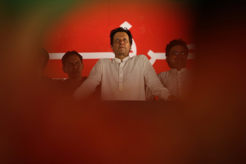 Imran Khan, chairman of the Pakistan Tehreek-e-Insaf (PTI) looks on during a campaign meeting ahead of general elections in Islamabad