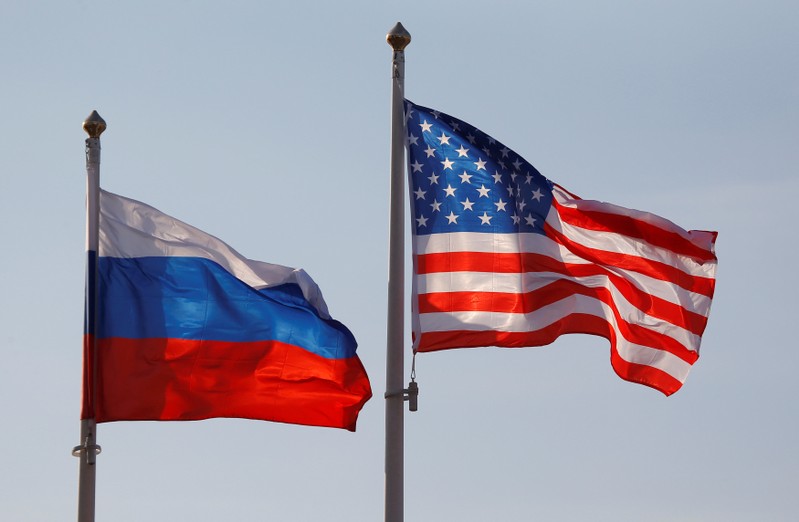 FILE PHOTO: National flags of Russia and U.S. fly at Vnukovo International Airport in Moscow