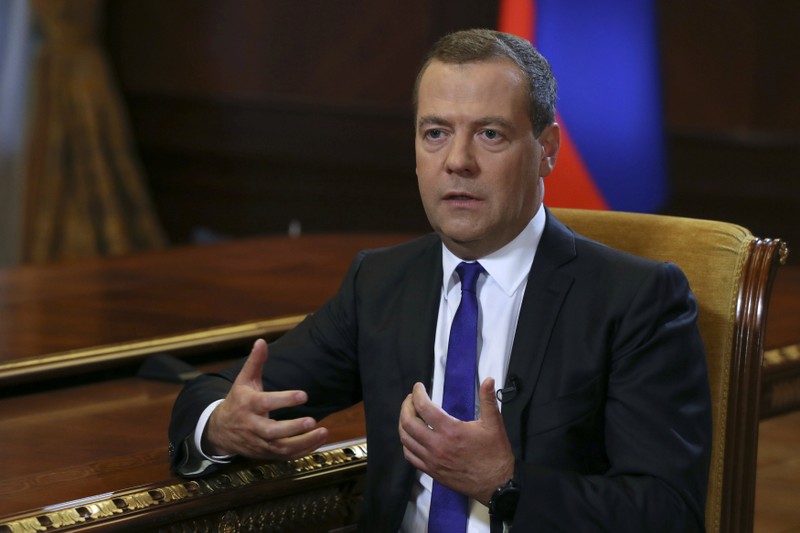 Russian PM Medvedev speaks during an interview with Russia's Kommersant newspaper at the Gorki state residence outside Moscow