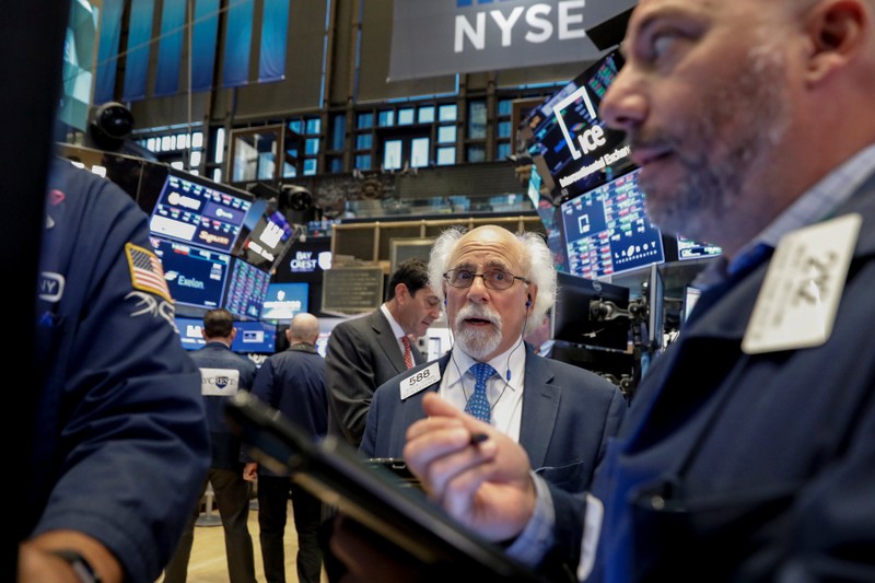 Traders work on the floor of the NYSE in New York