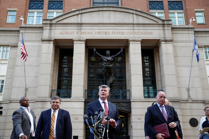 Defense attorneys Downing (C), Westling (2nd L) and Zehnle speak at the end of the third day of jury deliberations in the trial against Paul Manafort in Alexandria, Virginia