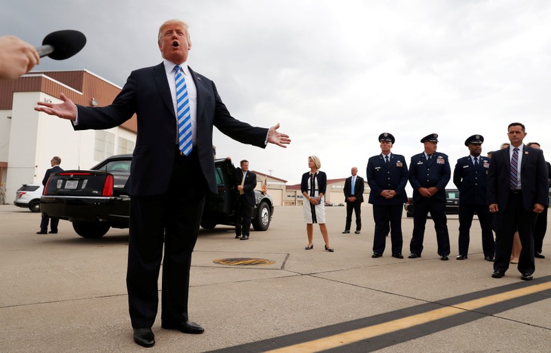 President Trump speaks to the news media about the conviction of Paul Manafort as he arrives in Charleston, West Virginia