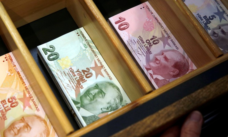 FILE PHOTO: Turkish lira banknotes are pictured at a currency exchange office in Istanbul