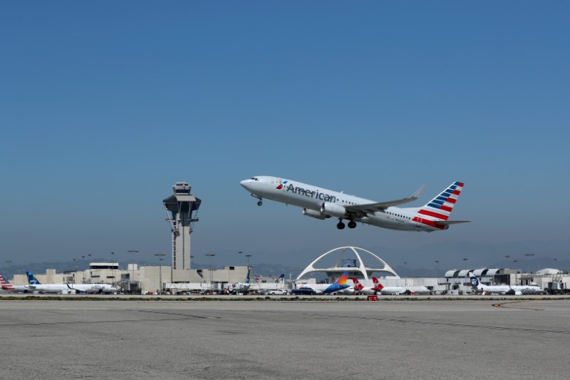 FILE PHOTO: An American Airlines Boeing 737 plane takes off from Los Angeles International airport