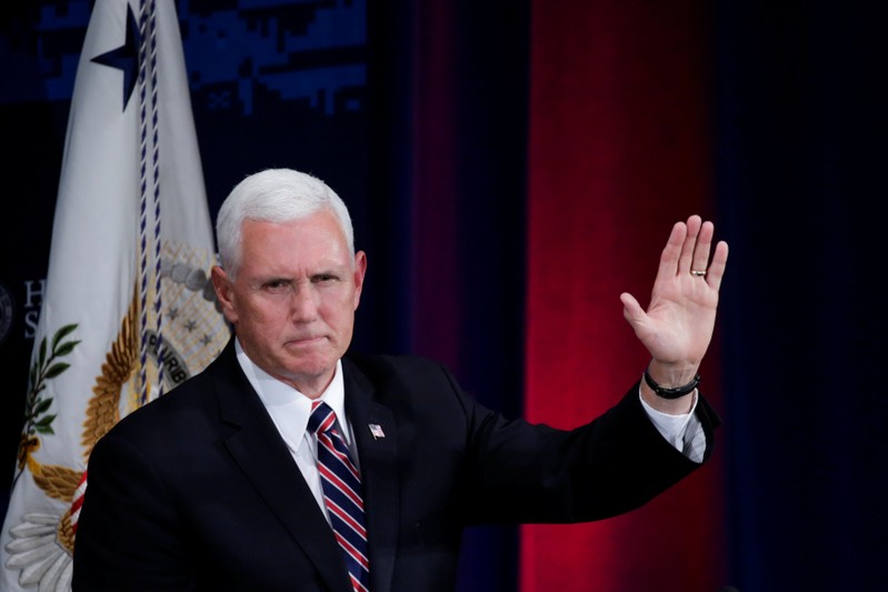 U.S. Vice President Pence waves to guests after speaking during the Department of Homeland Security's Cybersecurity Summit in Manhattan, New York