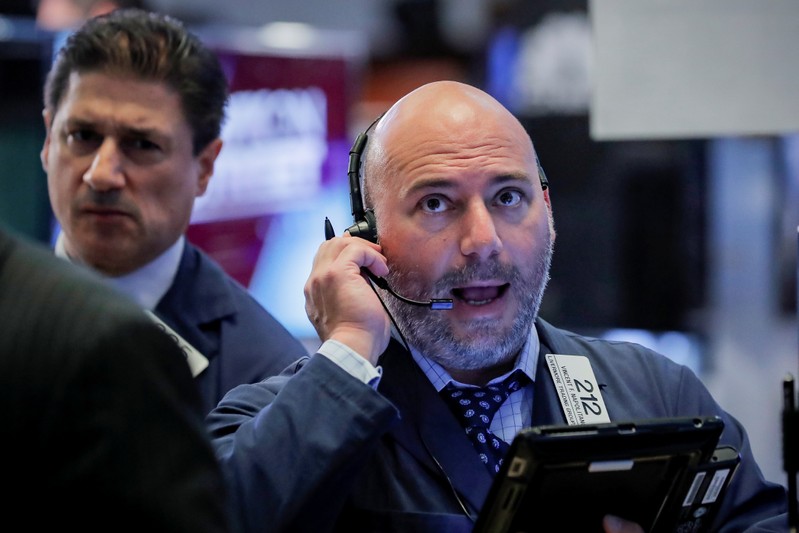 Traders work on the floor of the NYSE in New York