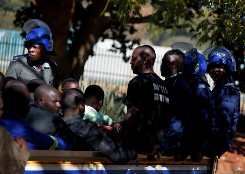 Some of the 16 people detained after police sealed off the building of Opposition Movement for Democratic Change (MDC) on Thursday, appear in court in the capital Harare