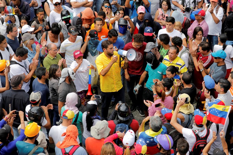 FILE PHOTO: Opposition lawmaker Juan Requesens gives a speech using a megaphone during a rally against Venezuela's President Nicolas Maduro in Caracas
