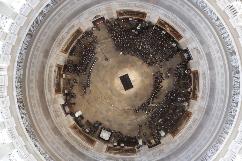 People await the arrival of the casket of U.S. Senator John McCain in the U.S. Capitol Rotunda in Washington