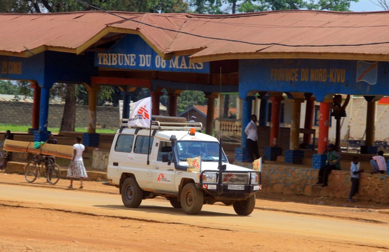 An ambulance from the Medecins Sans Frontieres drives through a street in the town of Beni in North Kivu province
