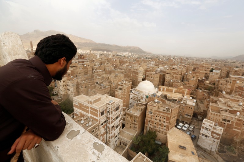 Man looks at buildings in the old quarter of Sanaa