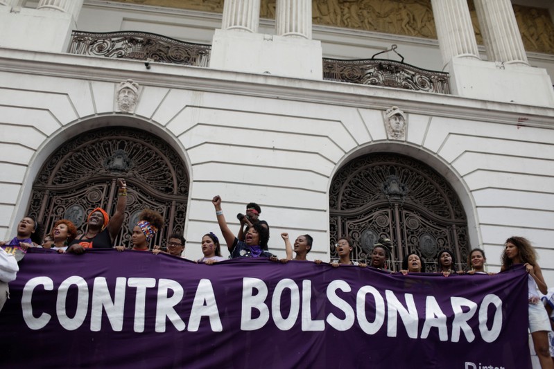 People demonstrate against presidential candidate Jair Bolsonaro in Rio de Janeiro