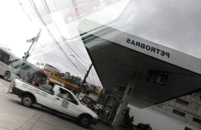 FILE PHOTO: A Petrobras gas station is pictured reflected in a car window in the outskirts of Sao Paulo