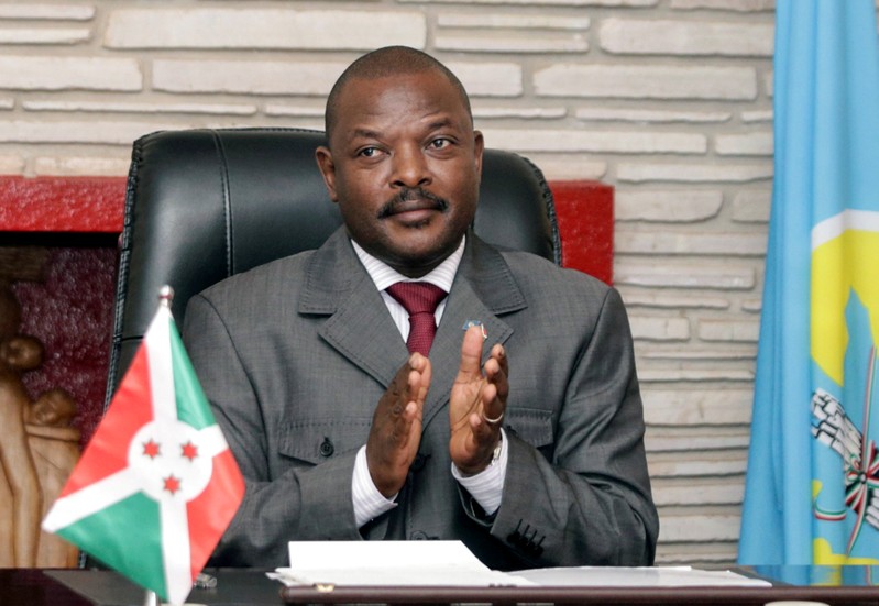FILE PHOTO: Burundi President Pierre Nkurunziza claps after signing the new constitution at the Presidential Palace in Gitega Province