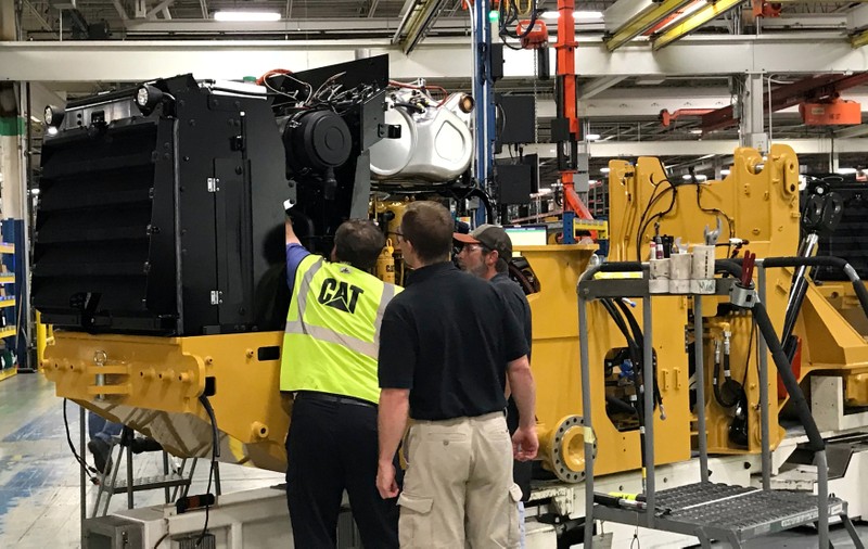 Employees work at Caterpillar's small wheel loader assembly plant is pictured in Clayton