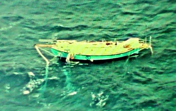 Indian Navy handout photo shows the capsized yacht Thuriya of solo sailor Abhilash Tomy at sea