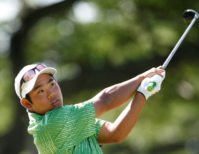 FILE PHOTO: Fujikawa of the U.S. hits off the third tee during the final round of the Sony Open golf tournament in Honolulu