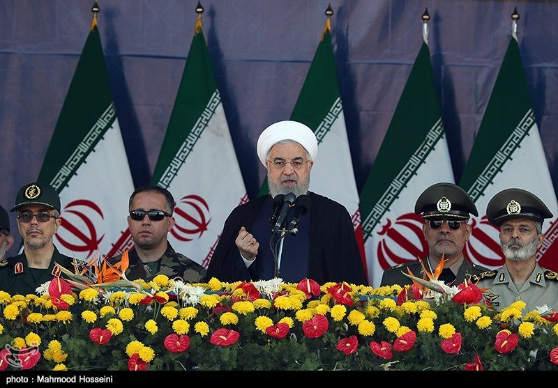 Iranian President Hassan Rouhani delivers a speech during the annual military parade in Tehran