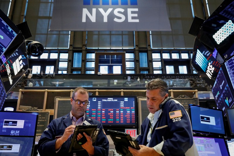 Traders work on the floor of the NYSE in New York