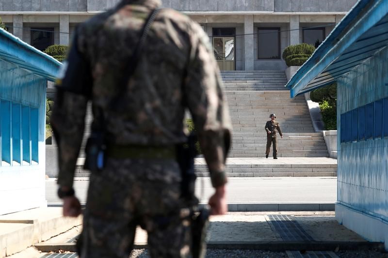 A North Korean soldier patrols at the truce village of Panmunjom