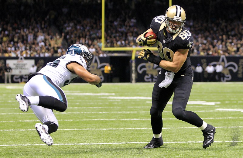 Saints' Graham stiff arms Eagles' Kendricks before scoring a touchdown during their NFL football game in New Orleans