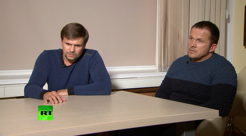 A still image shows two Russian men with the same names as those accused by Britain over Skripal case during an interview at an unidentified location