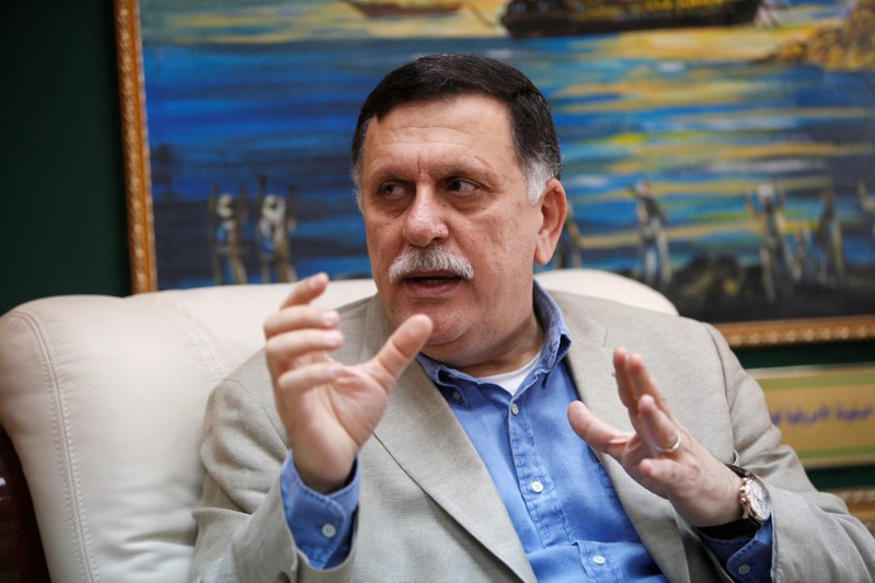 FILE PHOTO: Prime Minister of Libya's unity government Fayez Seraj speaks during an interview with Reuters at his office in the naval base of Tripoli