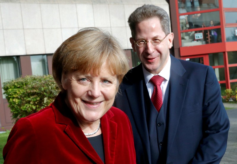 FILE PHOTO: German Chancellor Angela Merkel and Hans-Georg Maassen, the President of the Federal Office for the Protection of the Constitution, Germany's domestic security