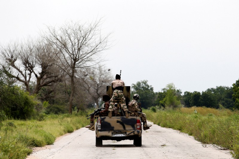 FILE PHOTO: A military vehicle drives along the Konduga-Bama road in Bama