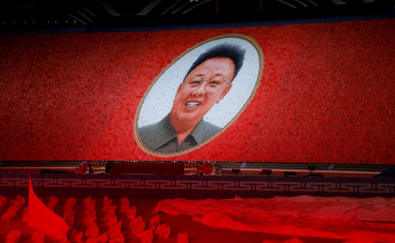 Participants form portrait of Kim Jong Il during Mass Games in May Day stadium marking the 70th anniversary of North Korea's foundation in Pyongyang
