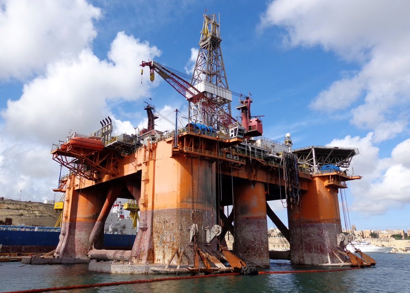 FILE PHOTO: An oil and gas drilling rig owned by Transocean Ltd sits idle in the Grand Harbor in Valletta
