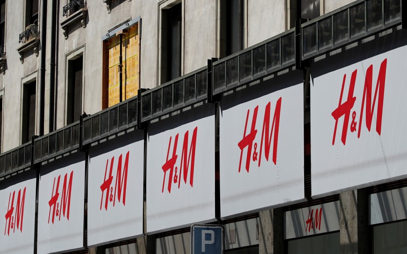 Logos of H&M are pictured on a store in Geneva