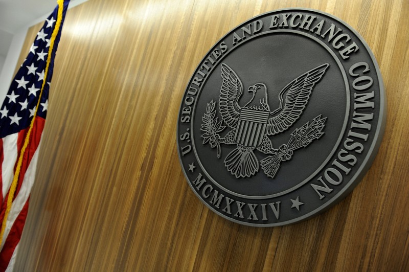 FILE PHOTO: The seal of the U.S. Securities and Exchange Commission hangs on the wall at SEC headquarters in Washington
