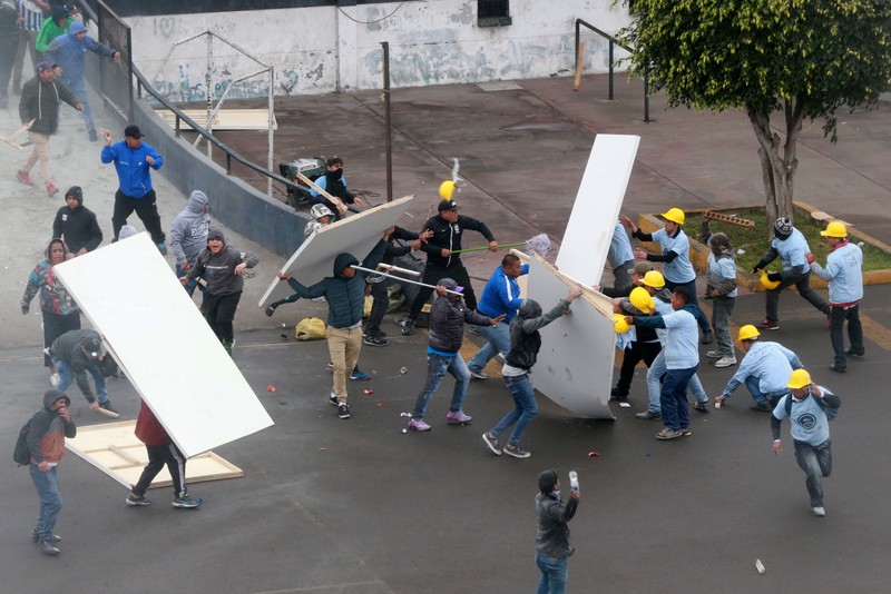 Alianza Lima's soccer fans and Evangelical Christians clash over a land dispute at the Alejandro Villanueva stadium, Lima