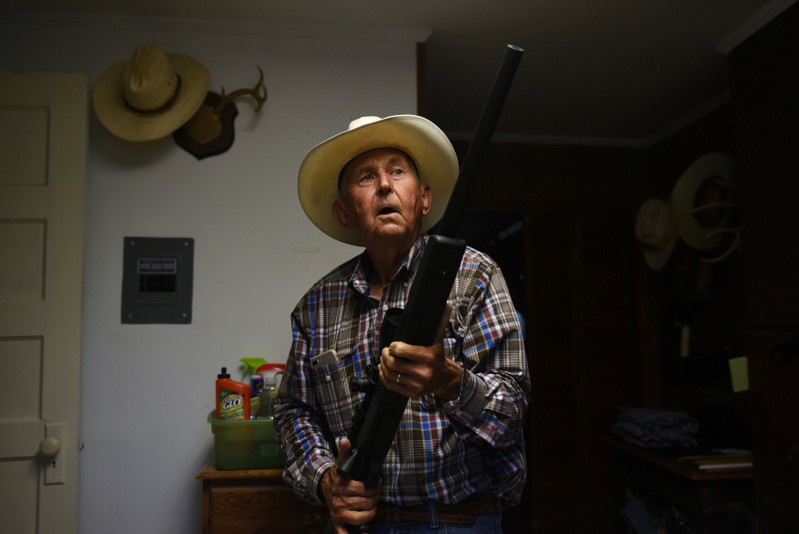 Bill Martin displays his gun collection at his home in Carizzo Springs