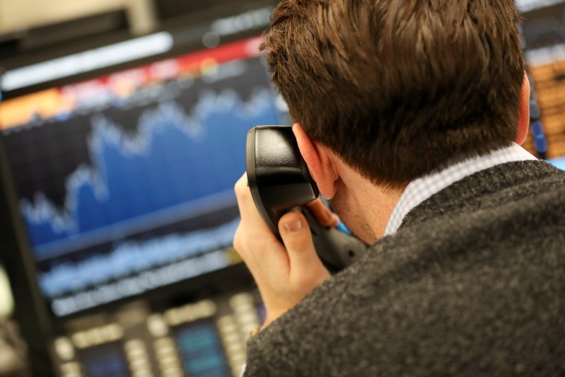 A broker looks at a graph on his computer screen on the dealing floor at ICAP in London