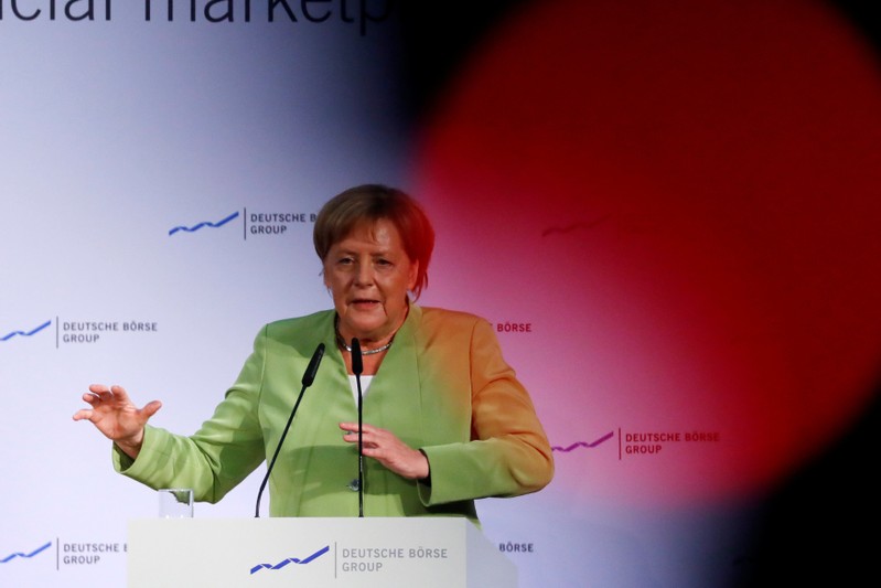 German chancellor Angela Merkel delivers a speech during a financial conference at the stock exchange in Frankfurt