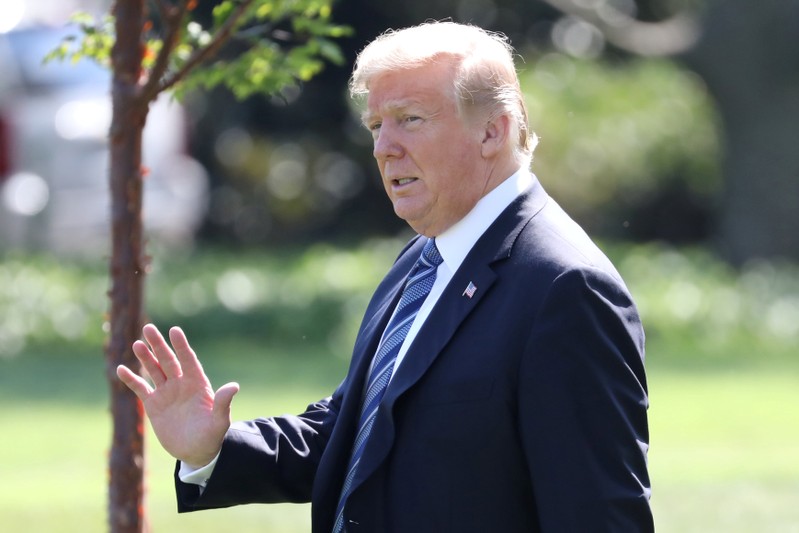 FILE PHOTO: U.S. President Donald Trump walks to Marine One while departing the White House in Washington