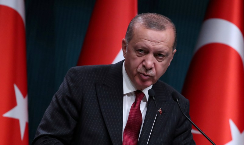 FILE PHOTO: Turkish President Tayyip Erdogan attends a news conference in Ankara