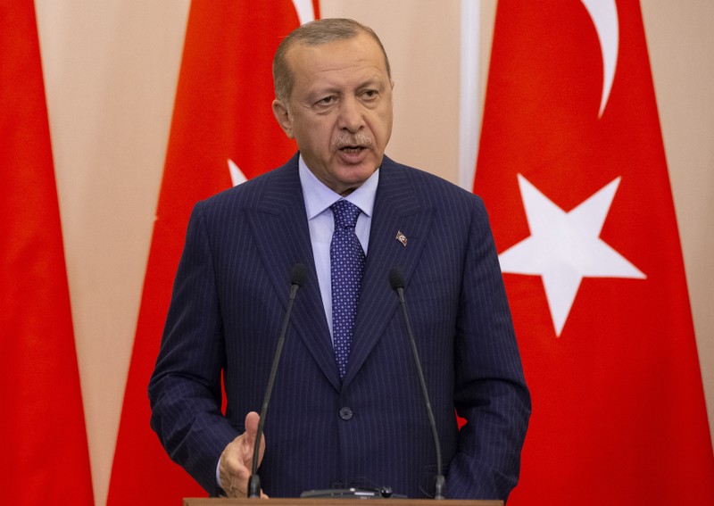 FILE PHOTO: Turkish President Erdogan speaks during a news conference