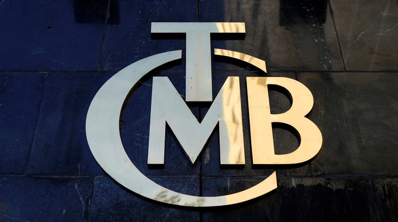 FILE PHOTO: A logo of Turkey's Central Bank is pictured at the entrance of the bank's headquarters in Ankara