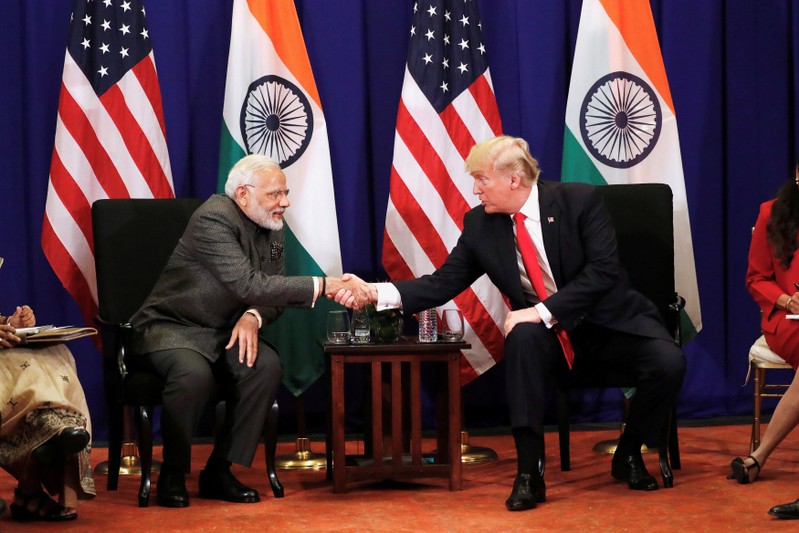 FILE PHOTO: U.S. President Donald Trump shakes hands with India's Prime Minister Narendra Modi during a bilateral meeting alongside the ASEAN Summit in Manila