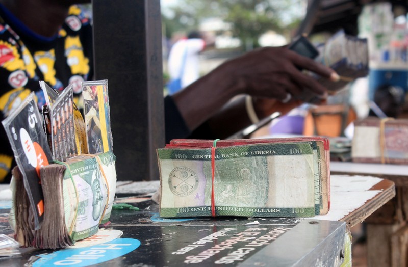 Liberian banknotes are pictured at a money changer's stand in Monrovia