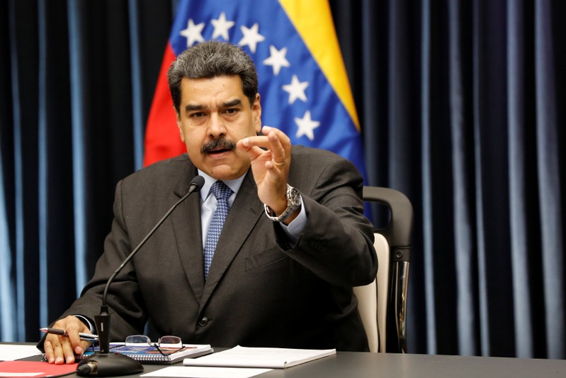 Venezuela's President Nicolas Maduro gestures as he talks to the media during a news conference at Miraflores Palace in Caracas
