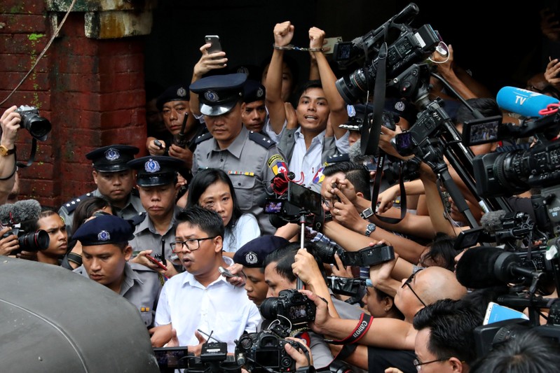 Detained Reuters journalists Wa Lone and Kyaw Soe Oo leave Insein court after listening to the verdict in Yangon