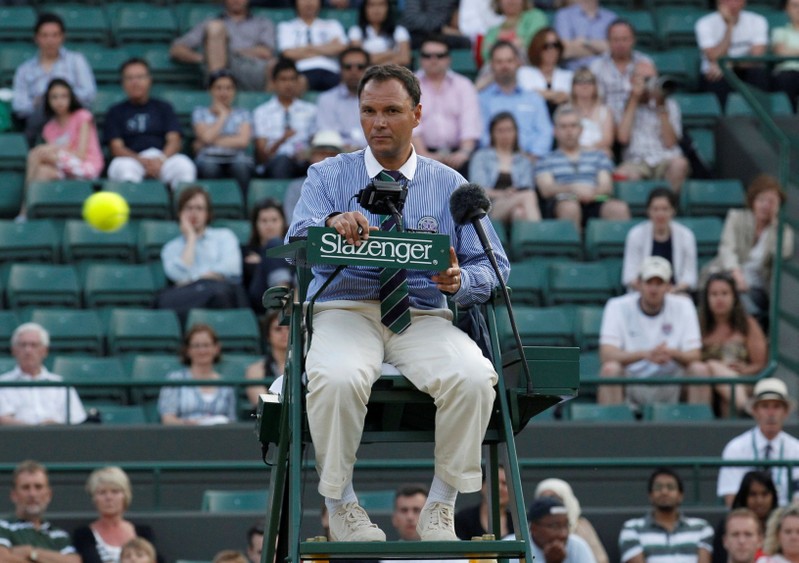 FILE PHOTO: Chair umpire Mohamed Lahyani watches the ball in the match between Belgium's Xavier Malisse and Sam Querrey of the U.S. at the 2010 Wimbledon tennis championships in London